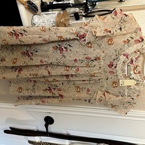 Large cream blouse with floral print.